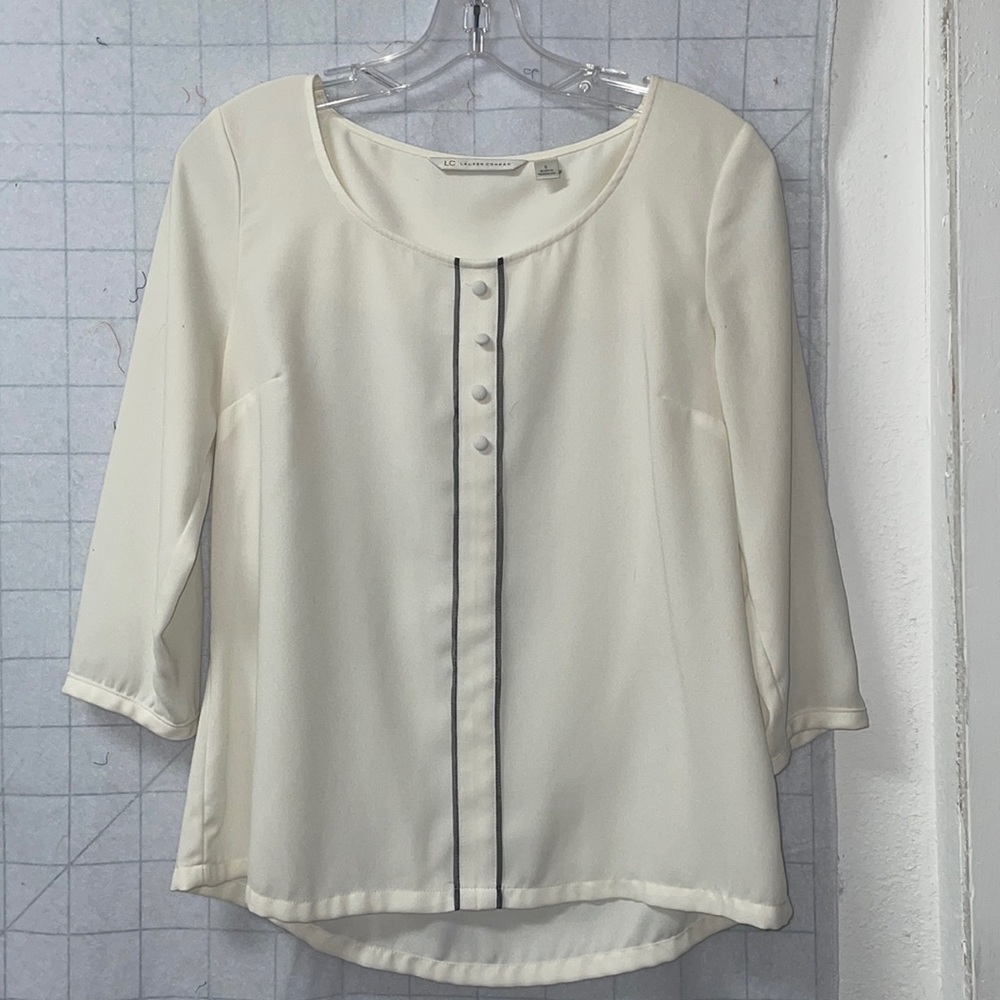 Ivory long sleeve top with gray trim accents.